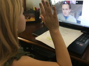 Child participating in a video call lesson.