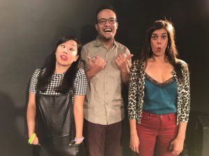 Three people making funny faces, posing.