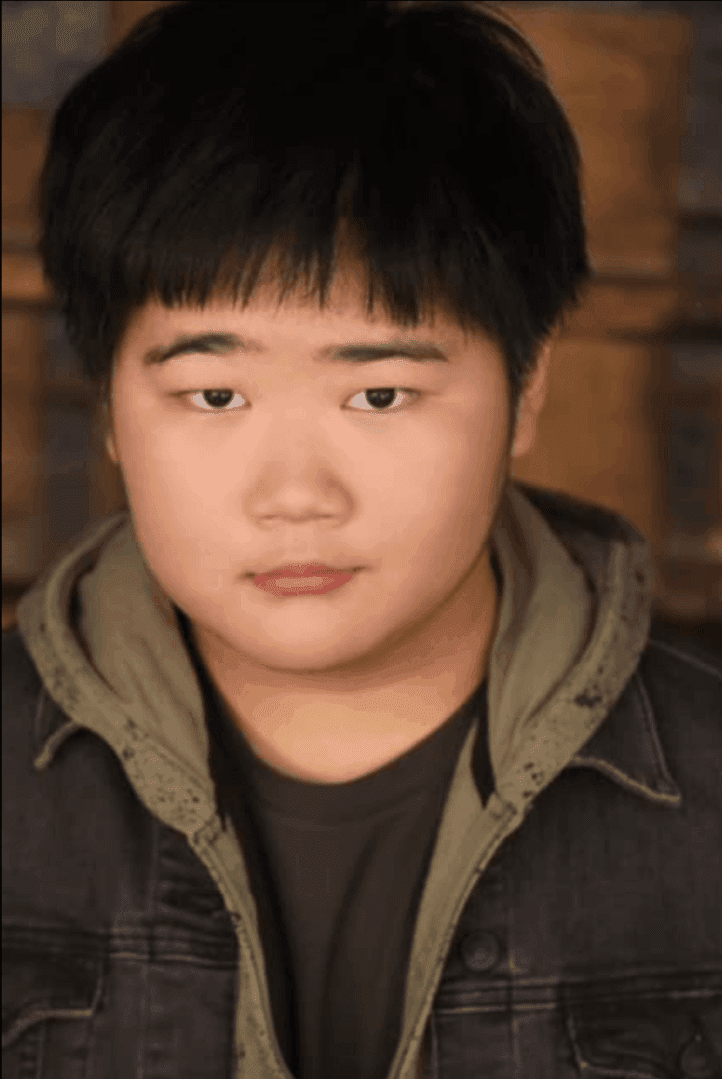 Portrait of a young person with a serious expression.